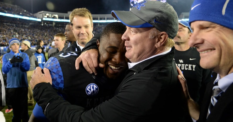 UK RB Jojo Kemp is hugged by head coach, Mark Stoops, after the University of Kentucky Wildcats Football game against the South Carolina Gamecocks in Lexington, KY. Saturday, October 4, 2014. By Mike Weaver, Special To The CJ, Imagn Images